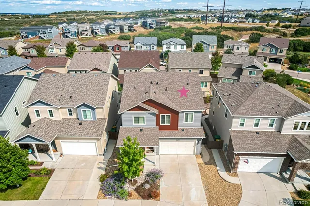 an aerial view of a city with lots of residential buildings