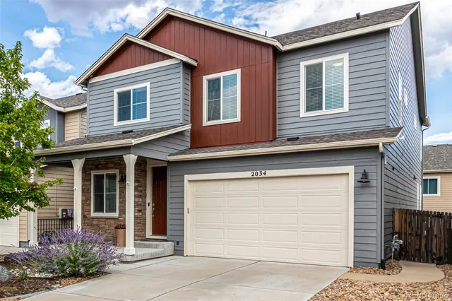 a front view of a house with a garage