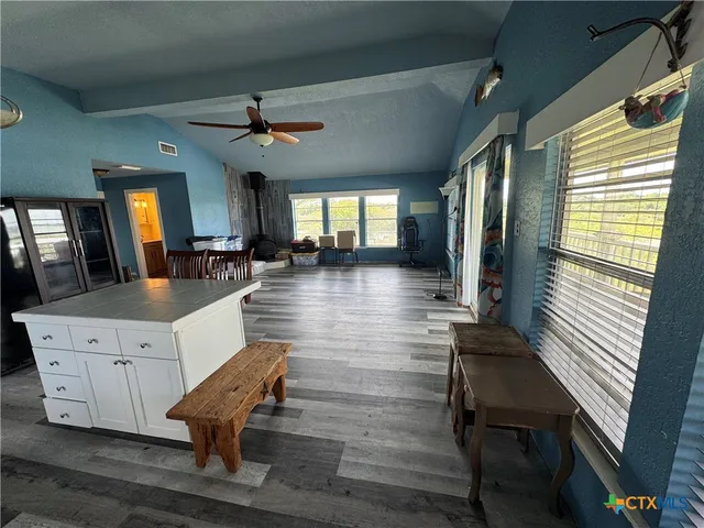 a lobby with furniture and wooden floor