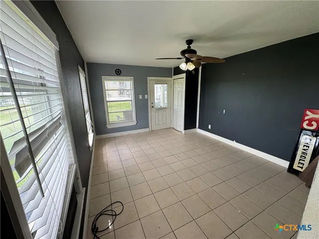 a view of an empty room and window
