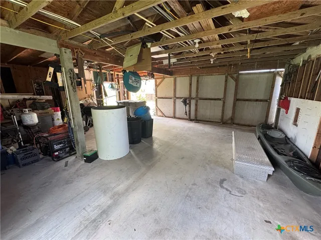 a view of a big yard with a house in the background