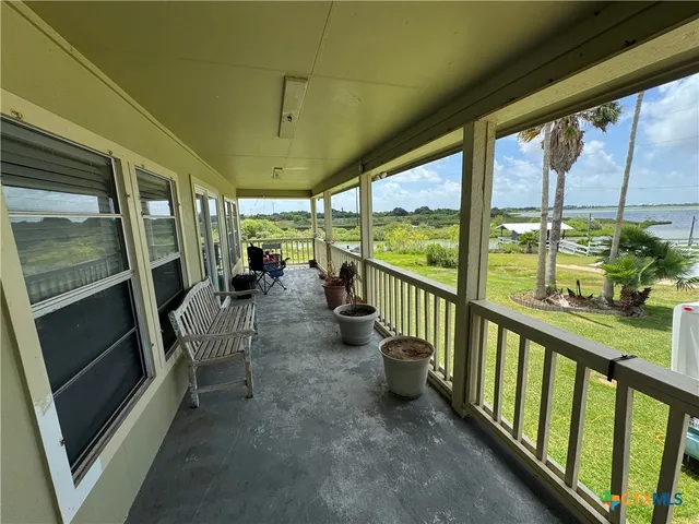 a view of a porch with chairs