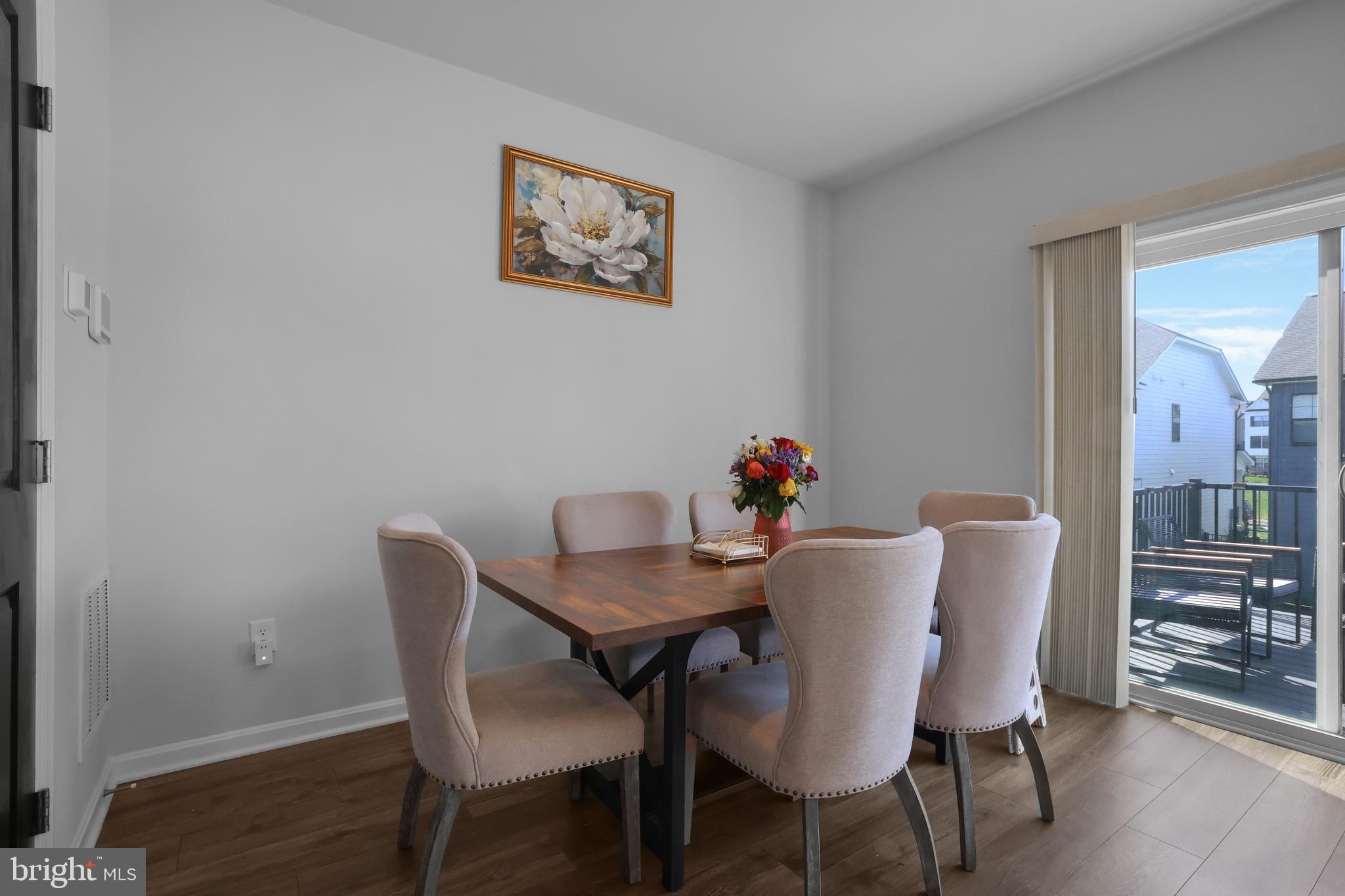 854 Amity Street Frederick, MD 21701 - Photo 16 of 62 a view of a dining room with furniture and wooden floor