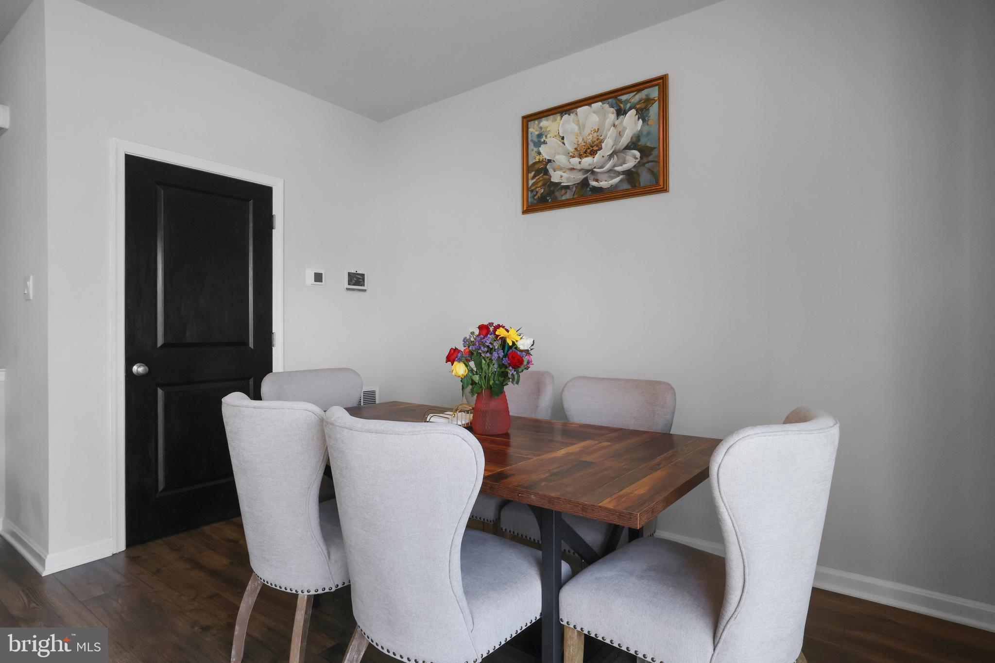 854 Amity Street Frederick, MD 21701 - Photo 18 of 62 a view of a dining room with furniture and wooden floor