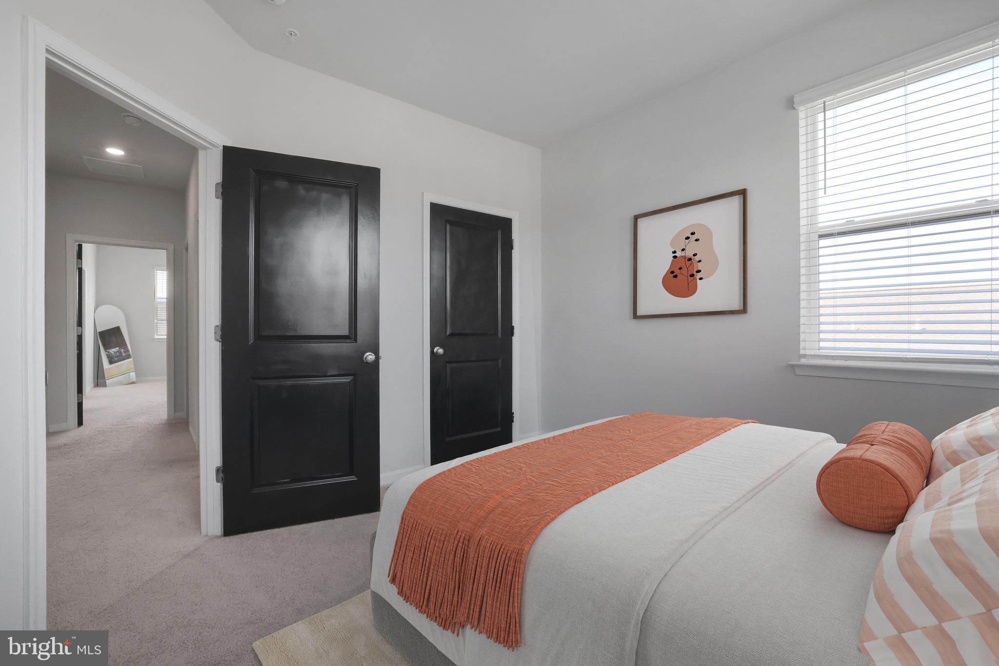 854 Amity Street Frederick, MD 21701 - Photo 26 of 62 a bedroom with a bed and a painting