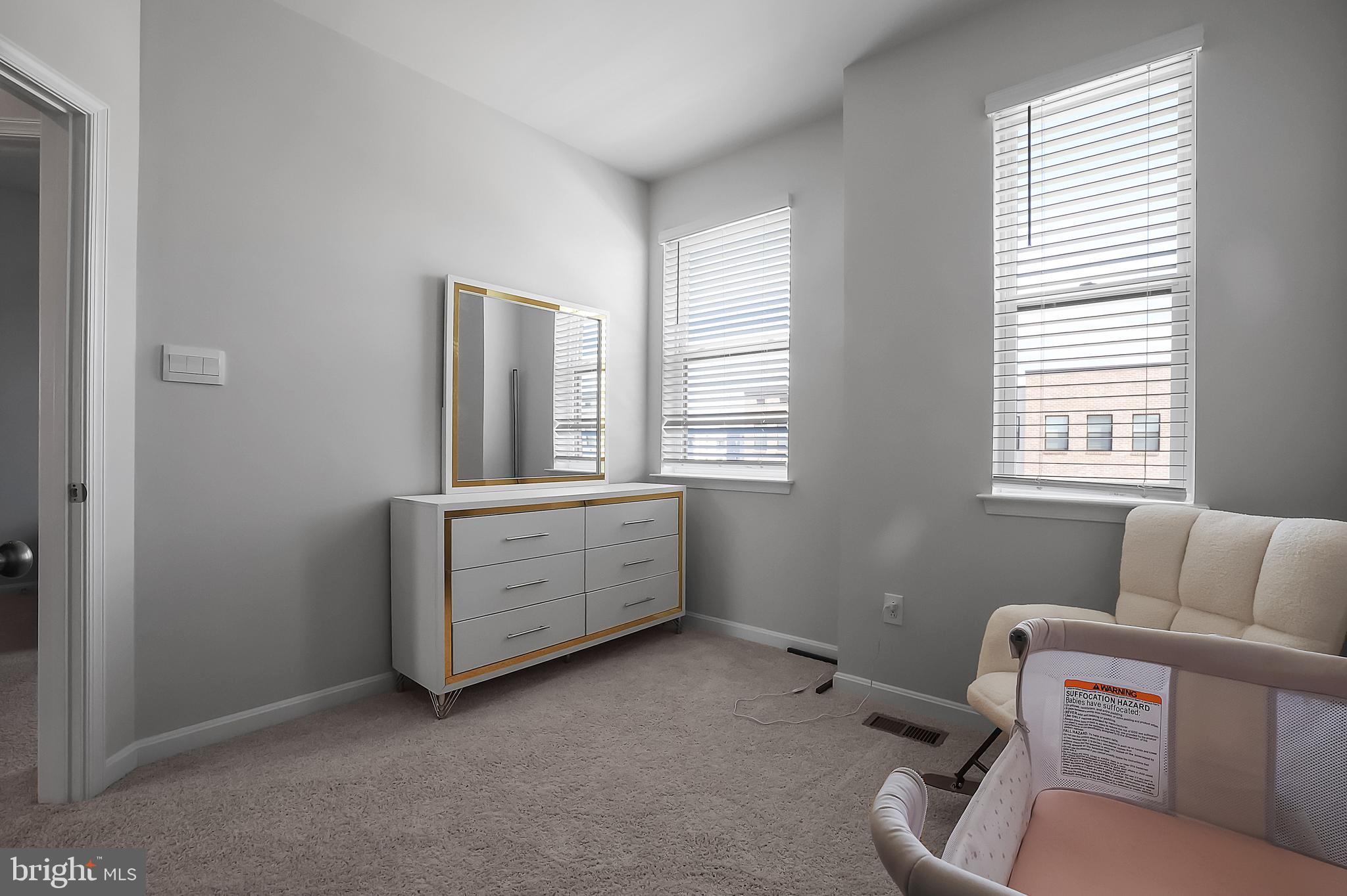 854 Amity Street Frederick, MD 21701 - Photo 28 of 62 a room with furniture and window