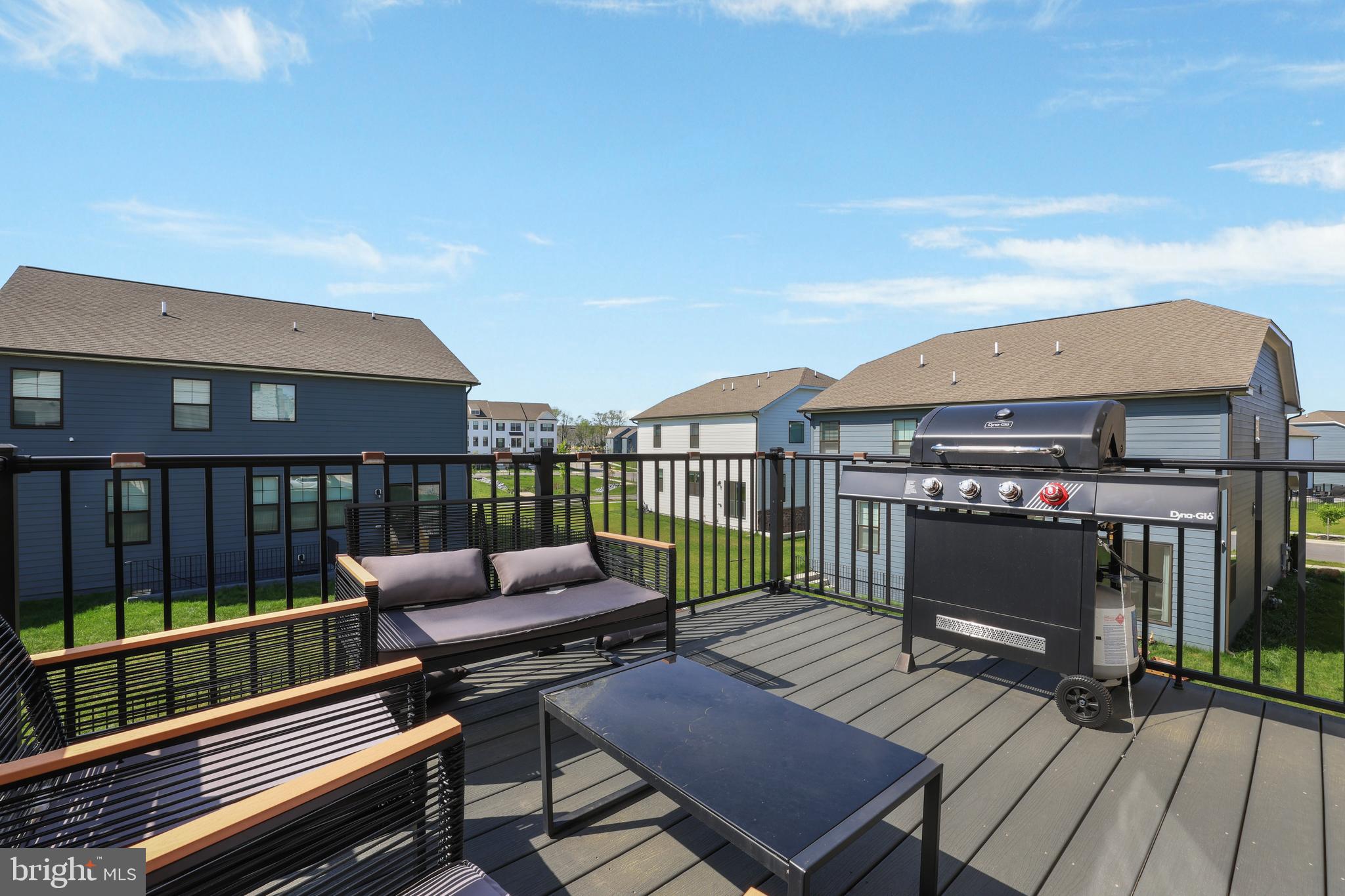 854 Amity Street Frederick, MD 21701 - Photo 32 of 62 a roof deck with a table and a chairs