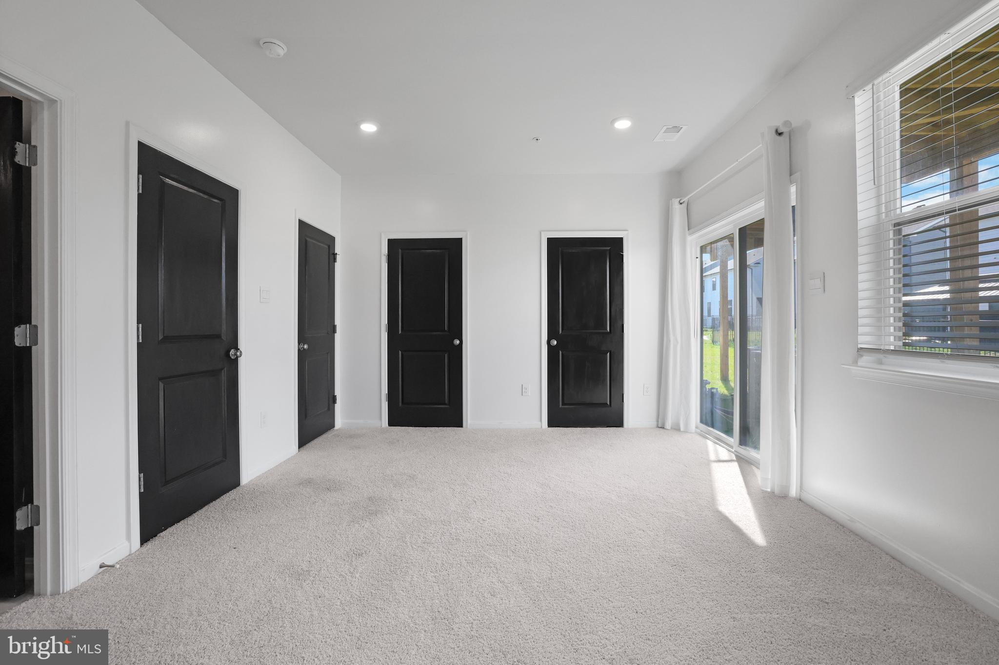 854 Amity Street Frederick, MD 21701 - Photo 36 of 62 a view of an empty room with windows