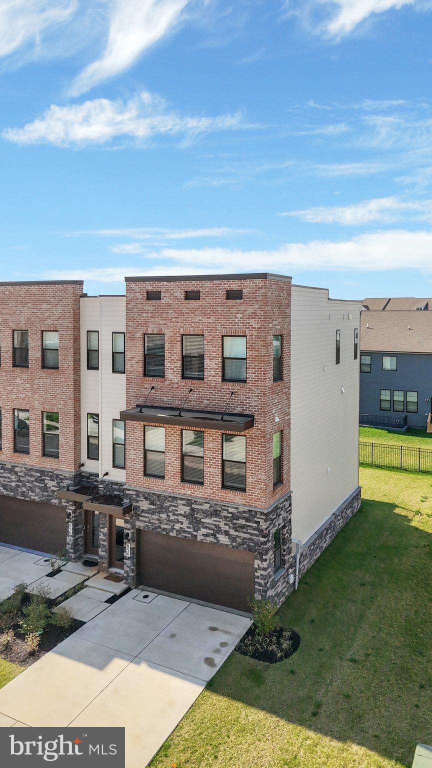 854 Amity Street Frederick, MD 21701 - Photo 48 of 62 a view of a building with a yard