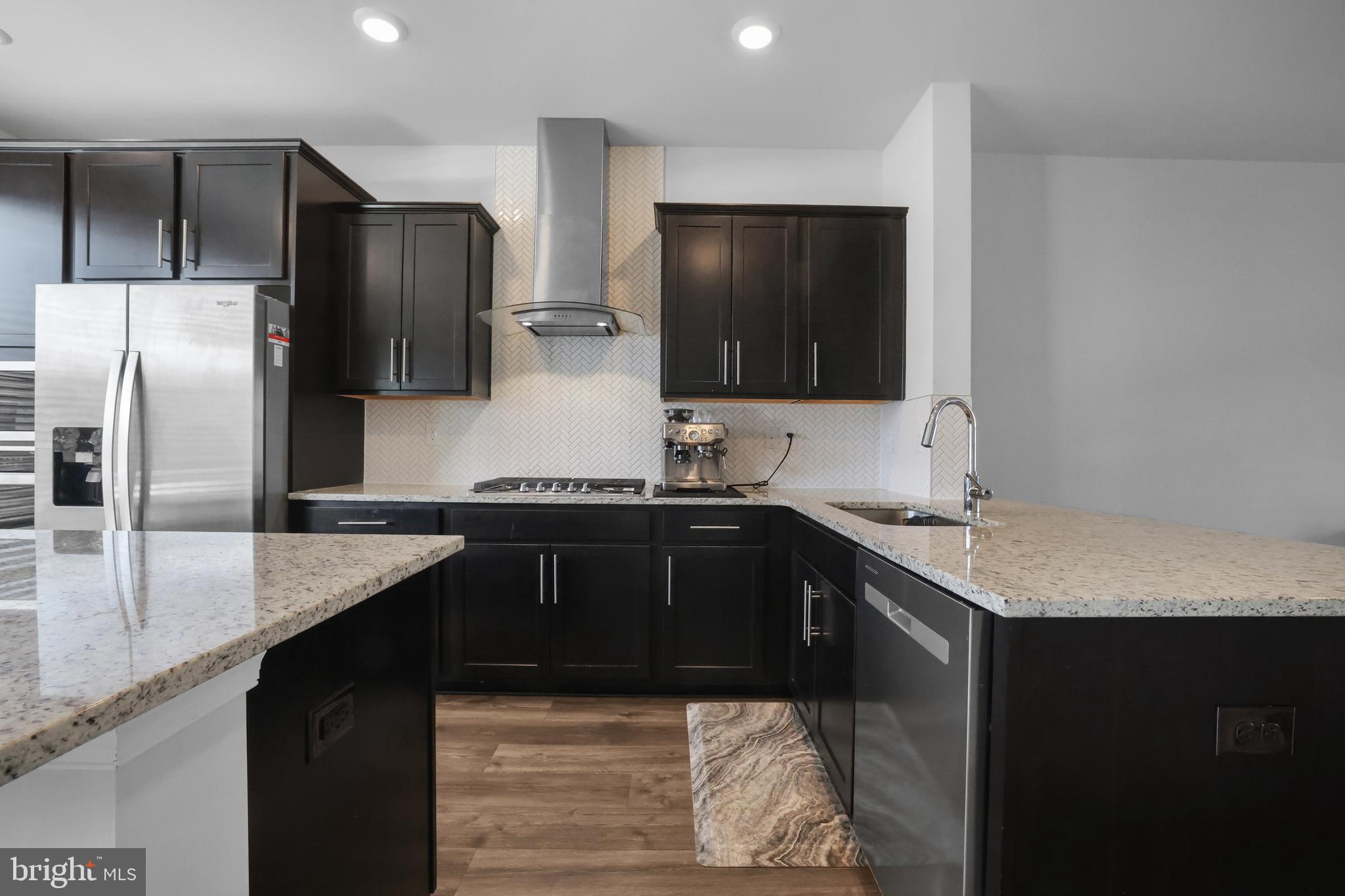 854 Amity Street Frederick, MD 21701 - Photo 5 of 62 a kitchen with stainless steel appliances granite countertop a sink and a refrigerator