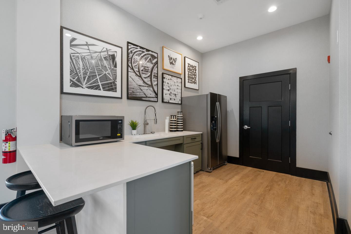 854 Amity Street Frederick, MD 21701 - Photo 52 of 62 a kitchen with stainless steel appliances a refrigerator and a stove top oven