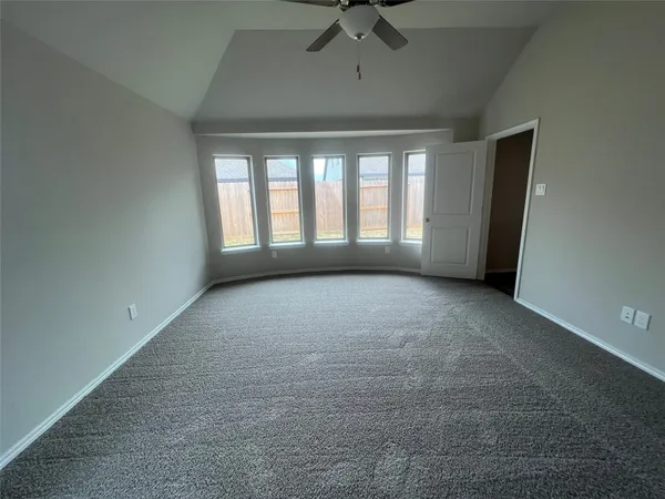 a view of hallway with wooden floor