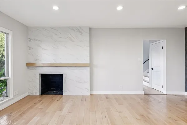 a kitchen with granite countertop a sink and stove top oven