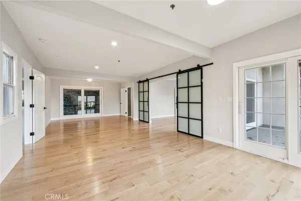 a bathroom with a granite countertop sink a mirror and bathtub