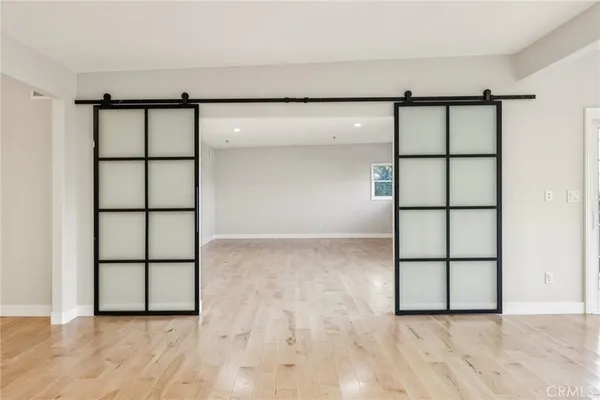 a view of outdoor space and deck with wooden fence