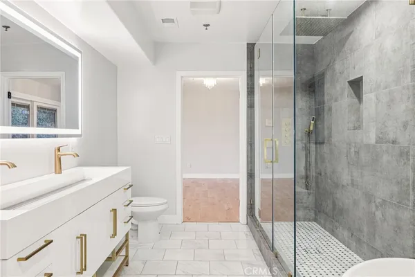 a view of a balcony with wooden floor and city view