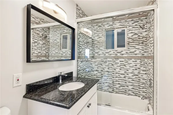 a view of a roof deck with wooden floor and fence