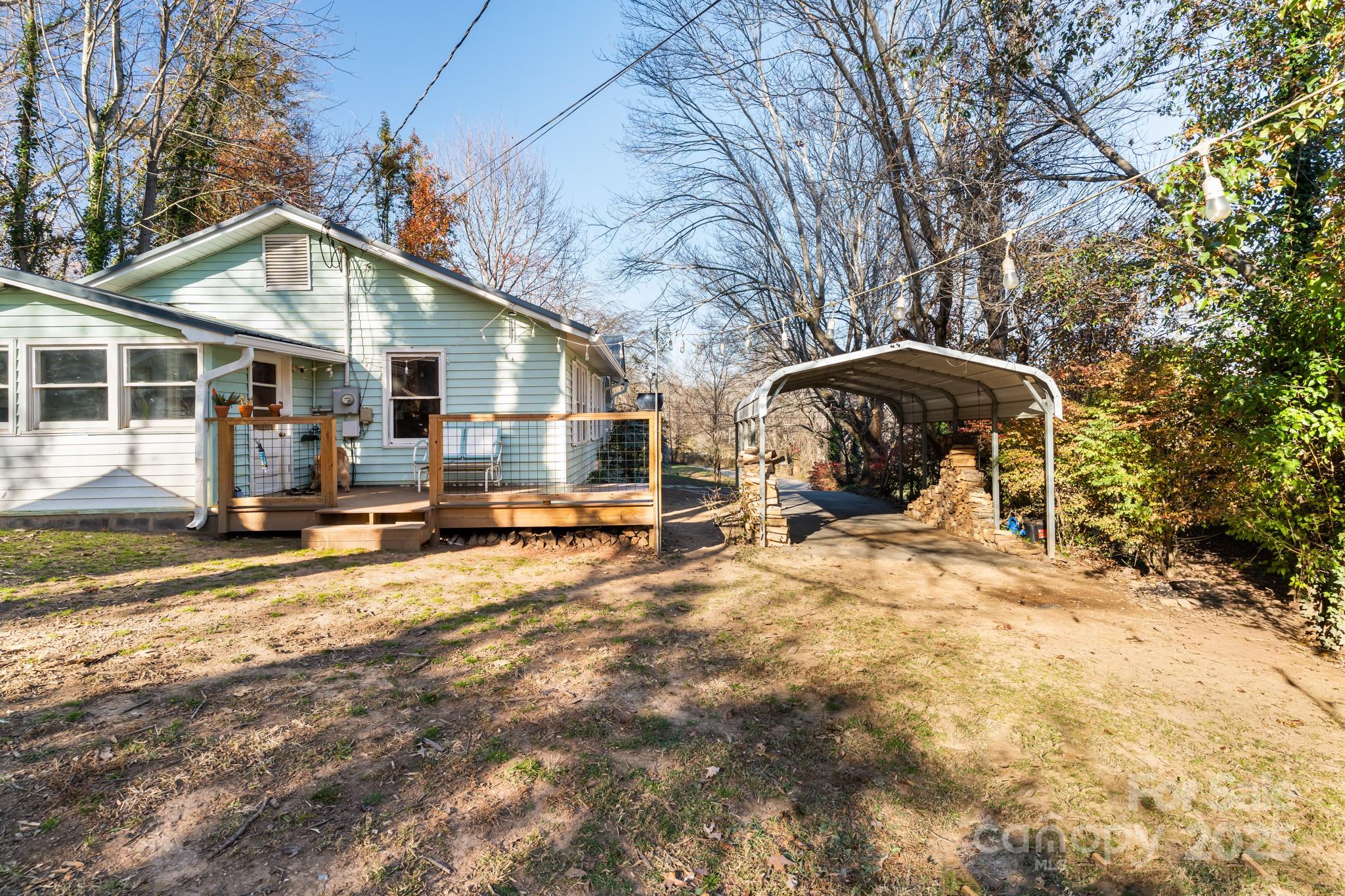 14 Sluder Branch Road Candler, NC 28715 - Photo 20 of 21 a view of a yard with a large tree in it
