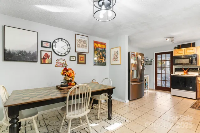 a kitchen with stainless steel appliances a sink stove and cabinets
