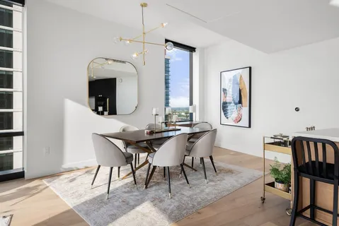a large bathroom with a double vanity sink a mirror and a bathtub