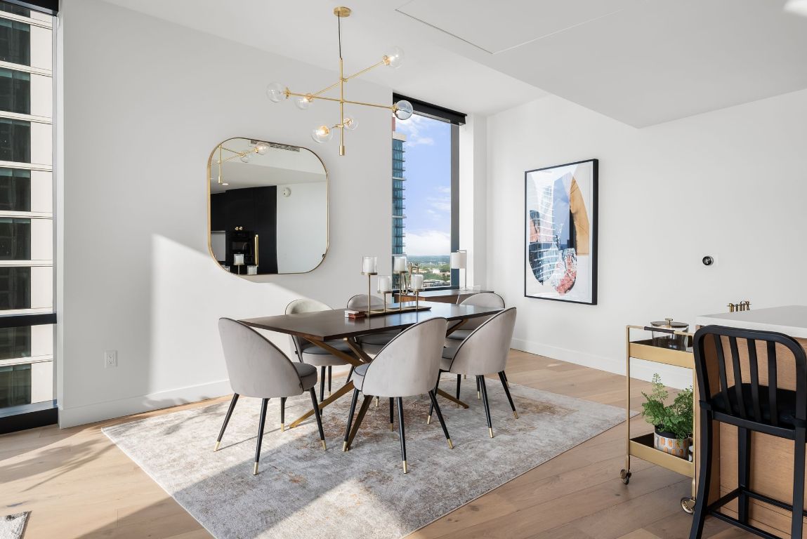 70 Rainey Street, Unit 2606 Austin, TX 78701 - Photo 13 of 37 a view of a a dining room with furniture window and wooden floor