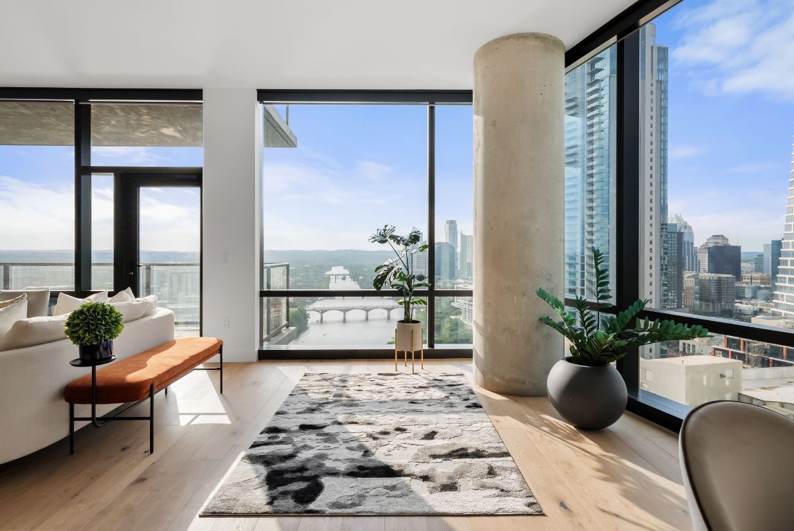 70 Rainey Street, Unit 2606 Austin, TX 78701 - Photo 14 of 37 a living room with furniture and a potted plant