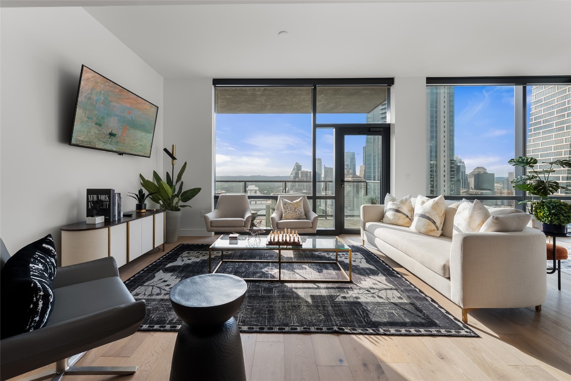 70 Rainey Street, Unit 2606 Austin, TX 78701 - Photo 16 of 37 a living room with furniture and a large window