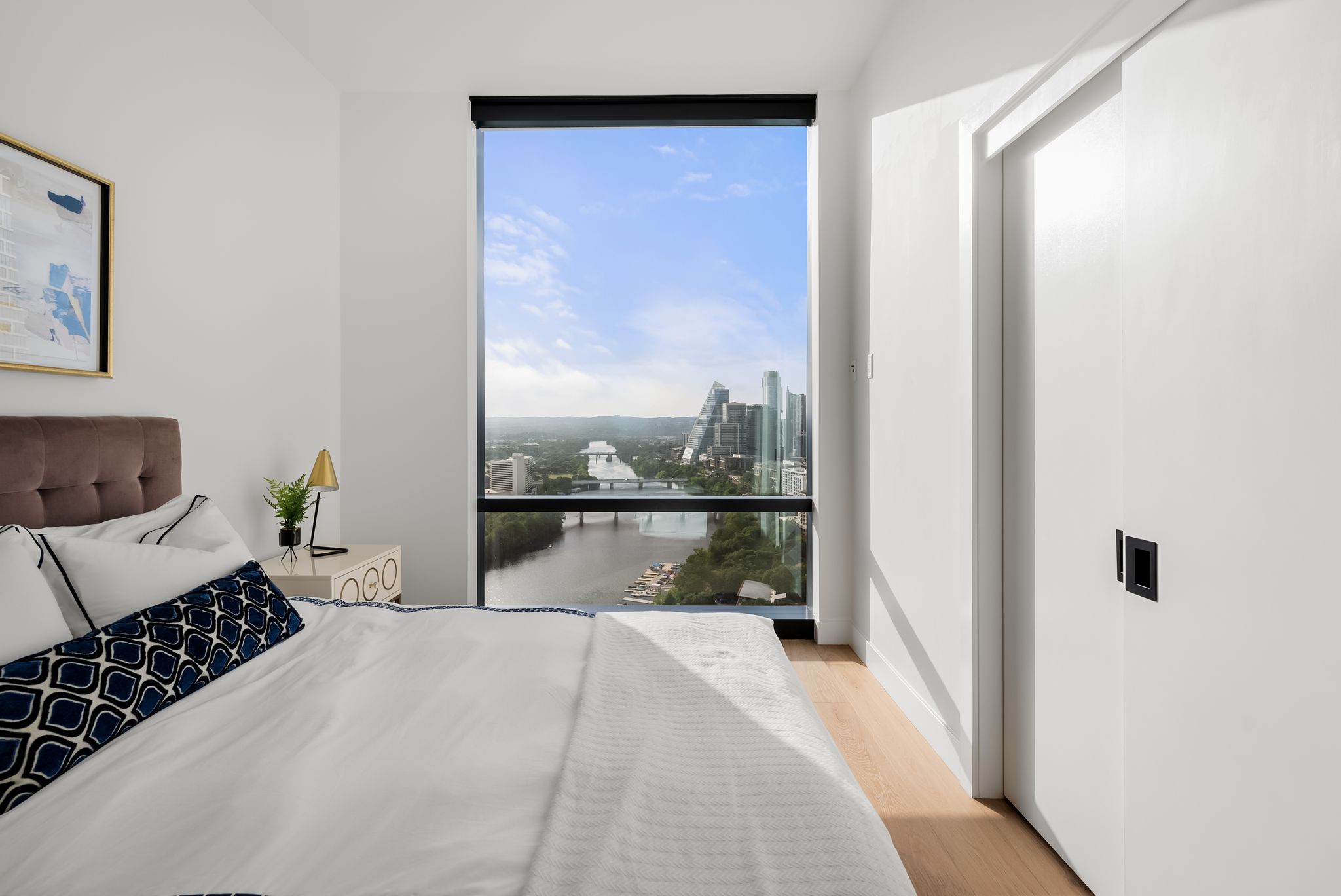 70 Rainey Street, Unit 2606 Austin, TX 78701 - Photo 17 of 37 a bedroom with a large bed and a window