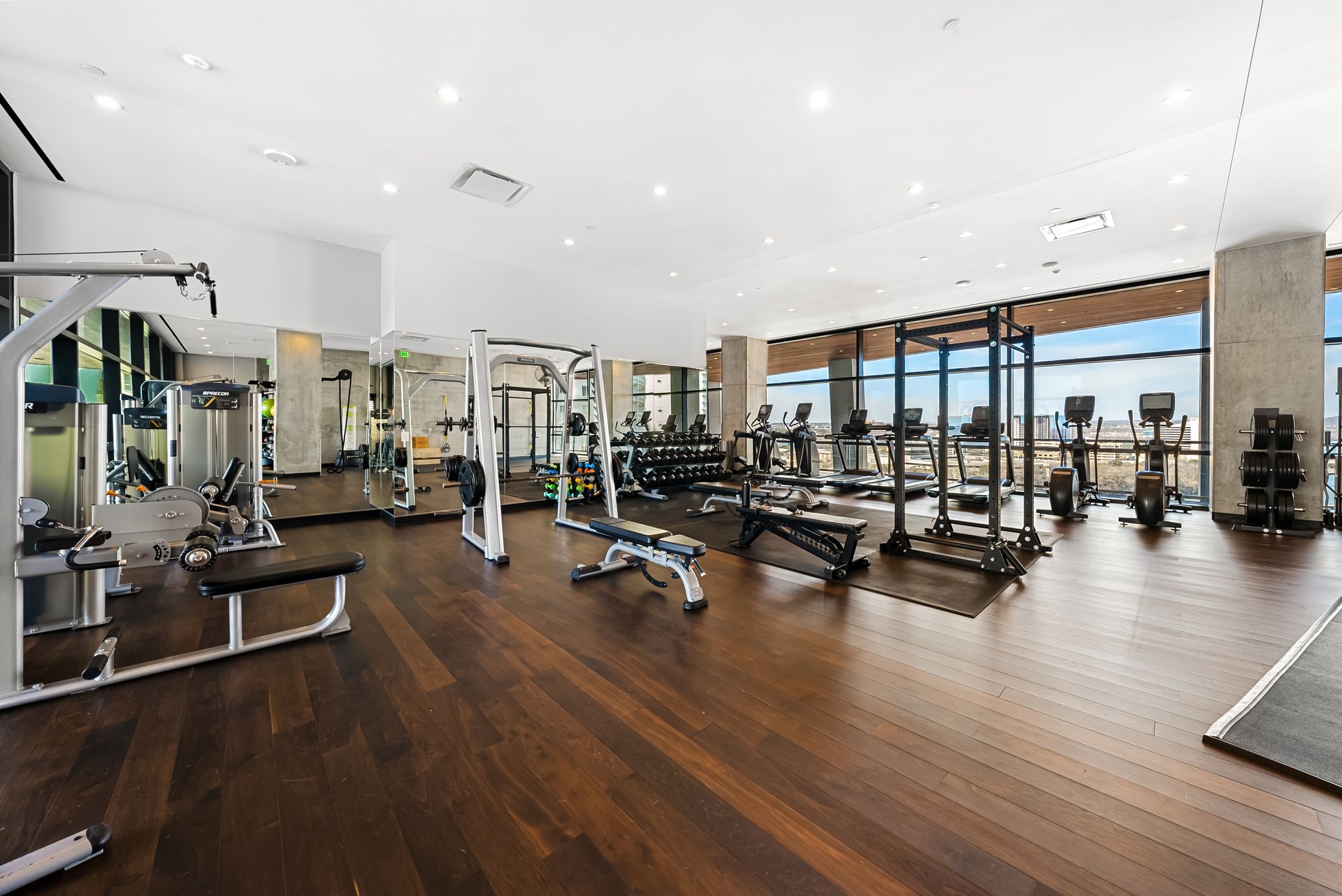 70 Rainey Street, Unit 2606 Austin, TX 78701 - Photo 29 of 37 a view of a room with gym equipment and wooden floor