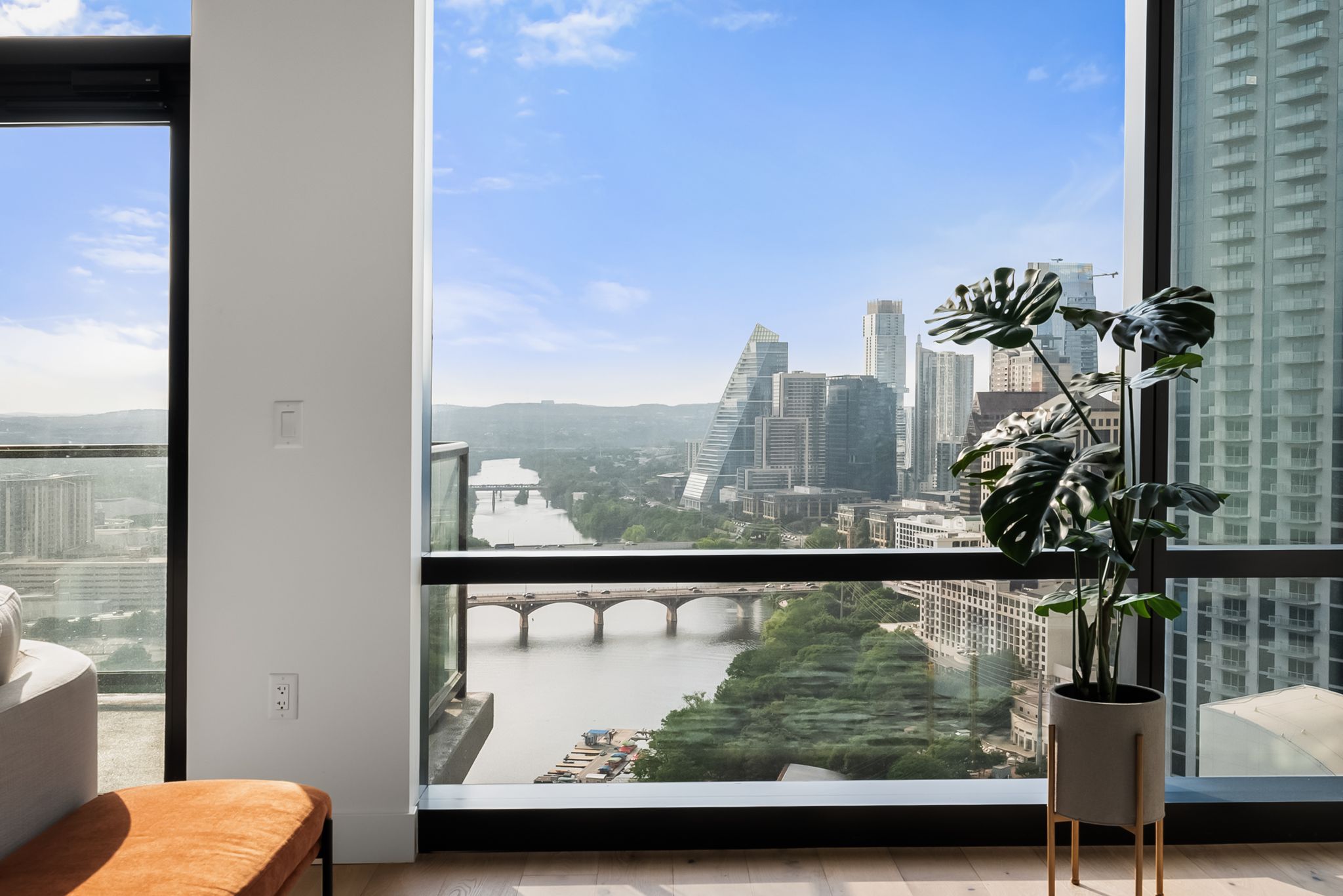 70 Rainey Street, Unit 2606 Austin, TX 78701 - Photo 5 of 37 a view of a balcony with couches and wooden floor