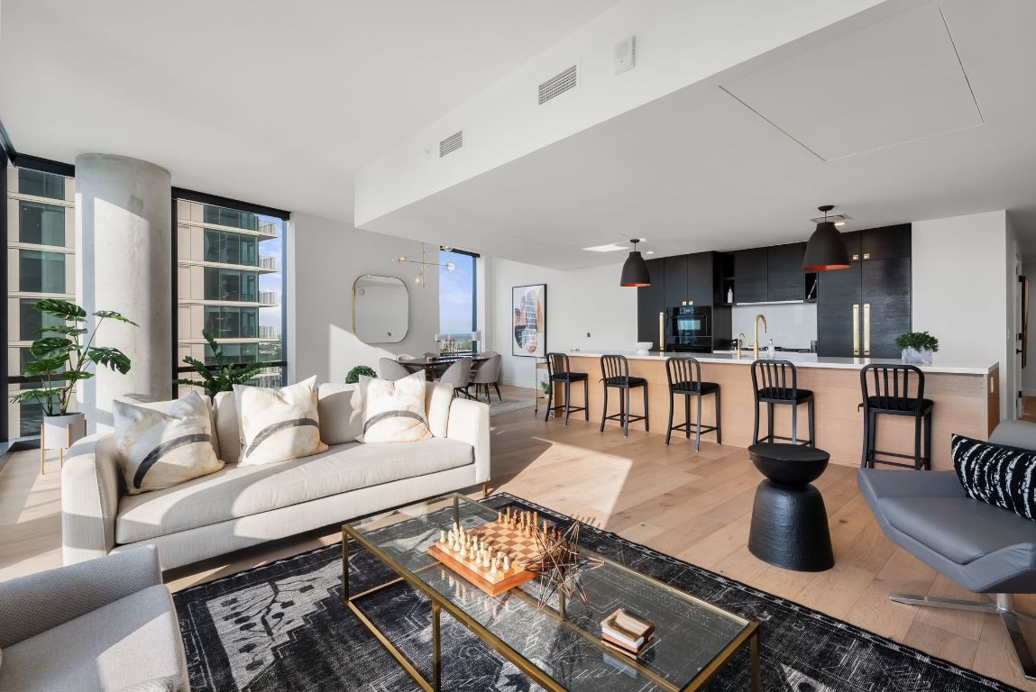 70 Rainey Street, Unit 2606 Austin, TX 78701 - Photo 8 of 37 a living room with furniture and a view of kitchen