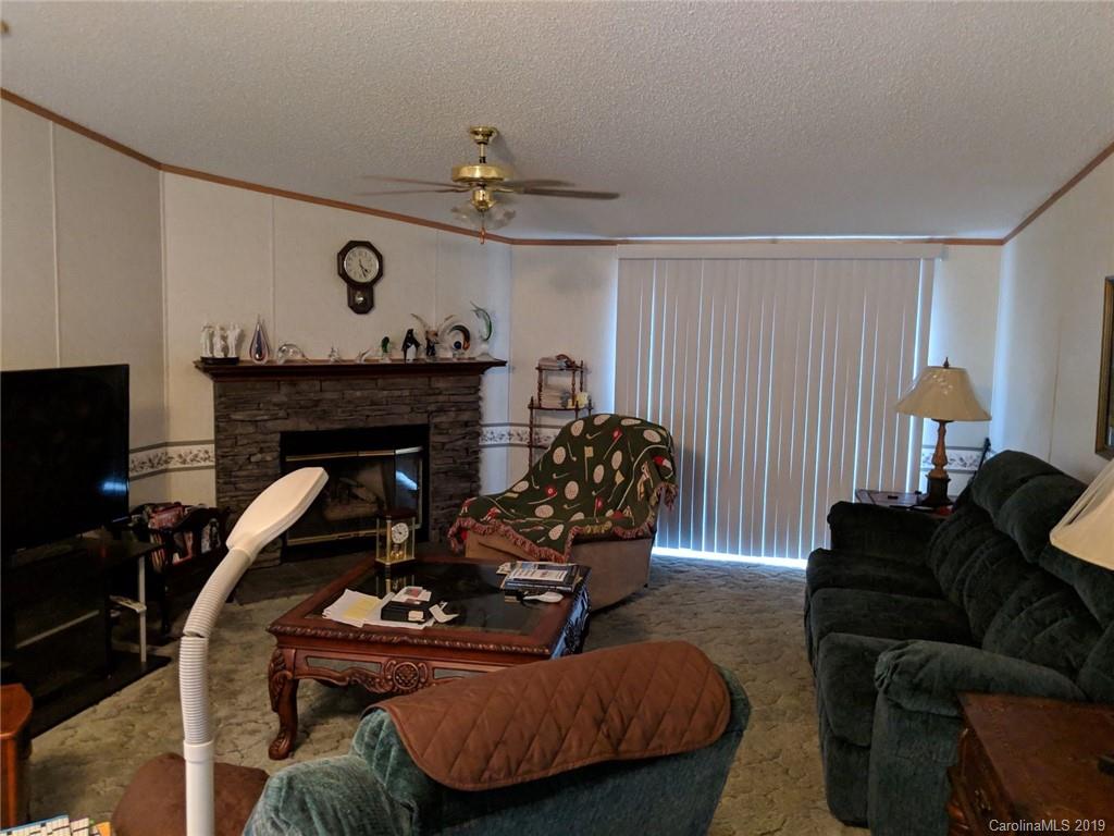 1090 State Rd S-46-1102 York, SC 29745 - Photo 4 of 10 a living room with furniture and a fireplace