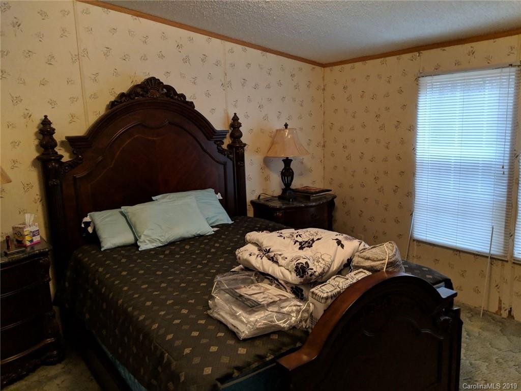 1090 State Rd S-46-1102 York, SC 29745 - Photo 6 of 10 a bedroom with a bed and a night stand