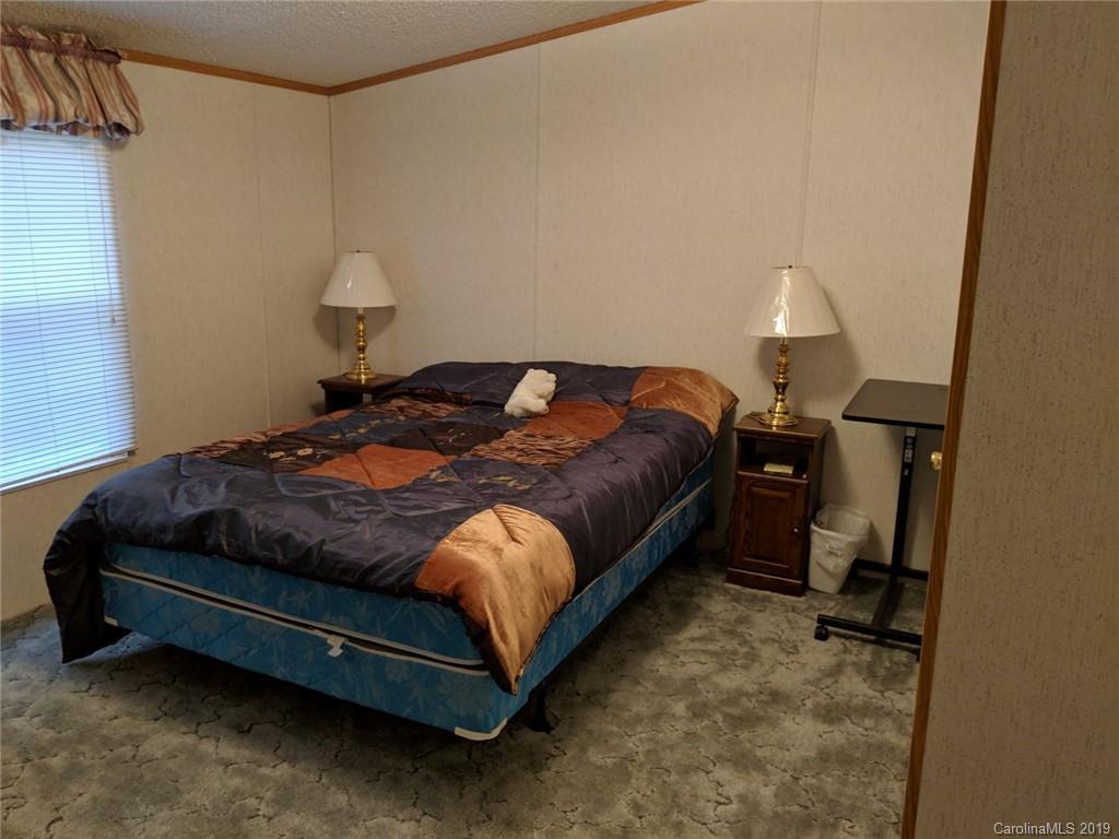 1090 State Rd S-46-1102 York, SC 29745 - Photo 9 of 10 a bedroom with a bed and a table in it