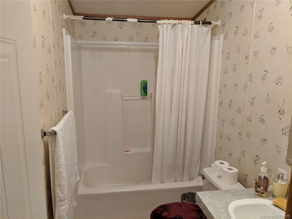 1090 State Rd S-46-1102 York, SC 29745 - Photo 10 of 10 a bathroom with a shower curtain and a sink