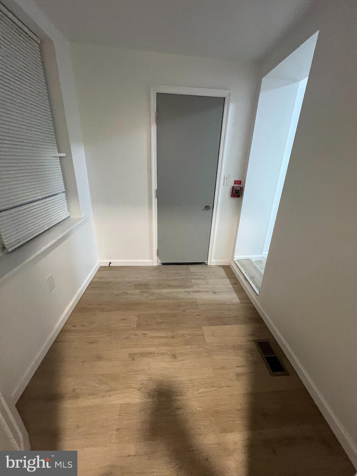 4422 Locust Street, Unit 1 2 Philadelphia, PA 19104 - Photo 11 of 30 a view of an empty room with wooden floor and stairs