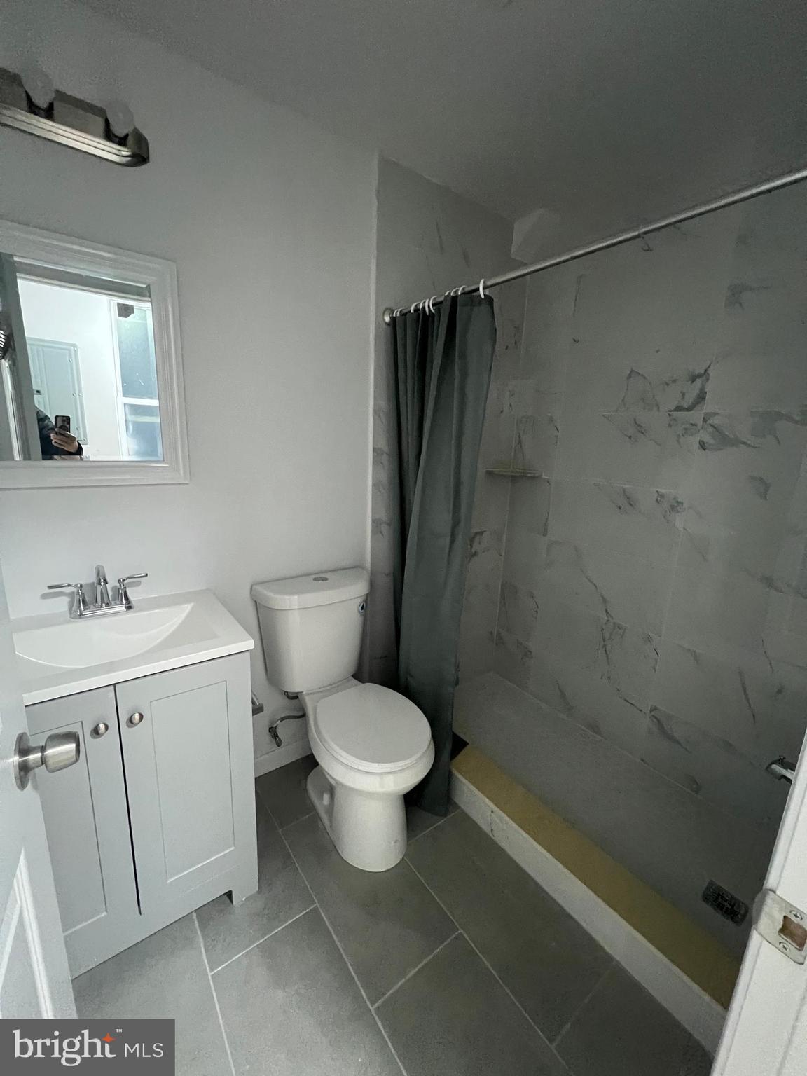 4422 Locust Street, Unit 1 2 Philadelphia, PA 19104 - Photo 20 of 30 a bathroom with a sink toilet and shower
