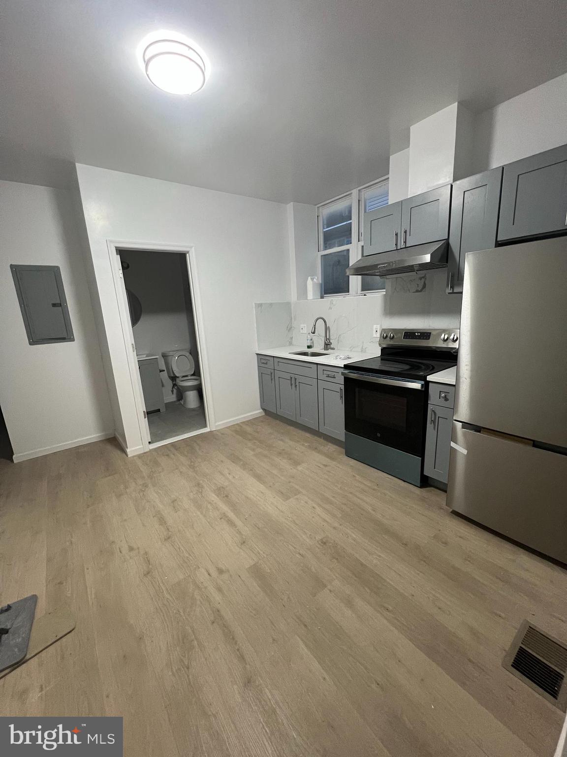 4422 Locust Street, Unit 1 2 Philadelphia, PA 19104 - Photo 5 of 30 a large kitchen with a stove a sink dishwasher and a refrigerator