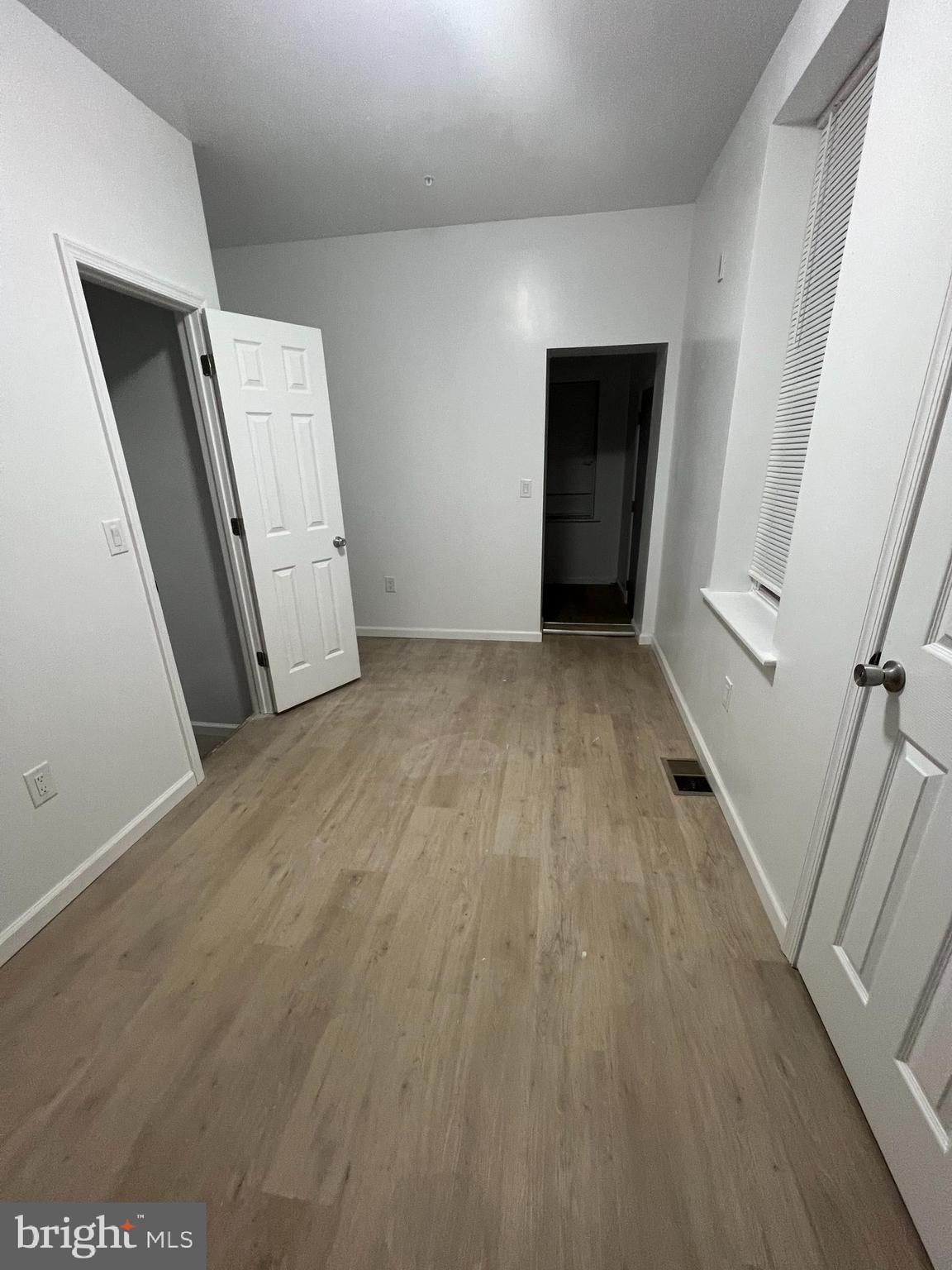 4422 Locust Street, Unit 1 2 Philadelphia, PA 19104 - Photo 9 of 30 an empty room with wooden floor and entrance