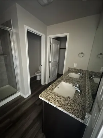 a bathroom with a sink and vanity