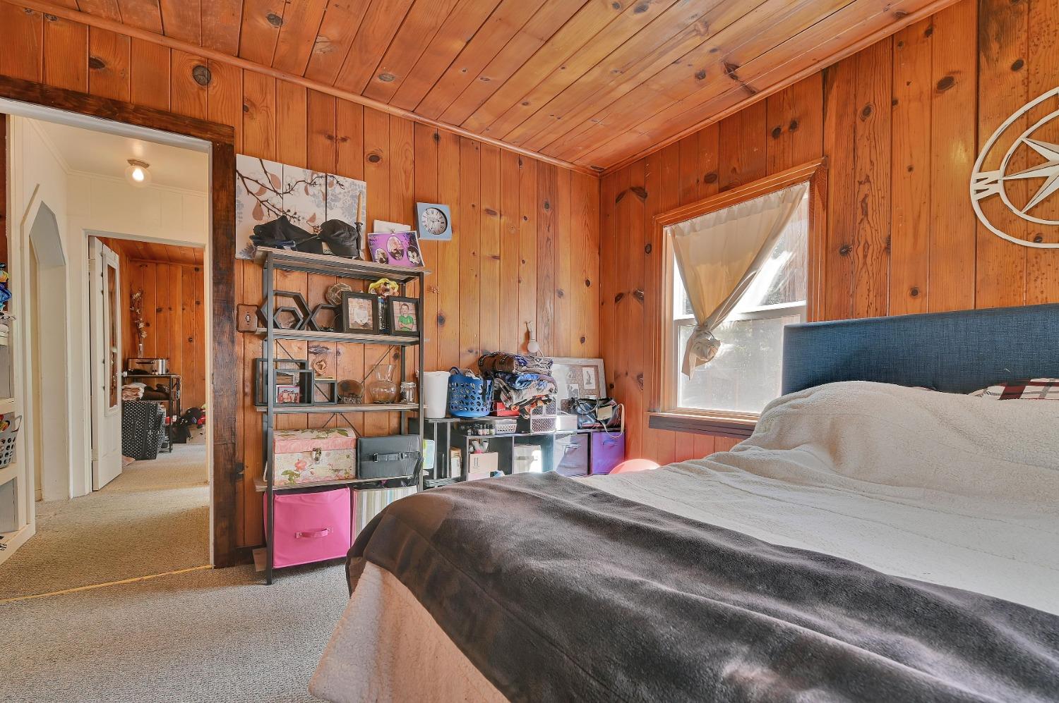 6016 Pony Express Trail Pollock Pines, CA 95726 - Photo 11 of 53 a bed room with a bed and a chair