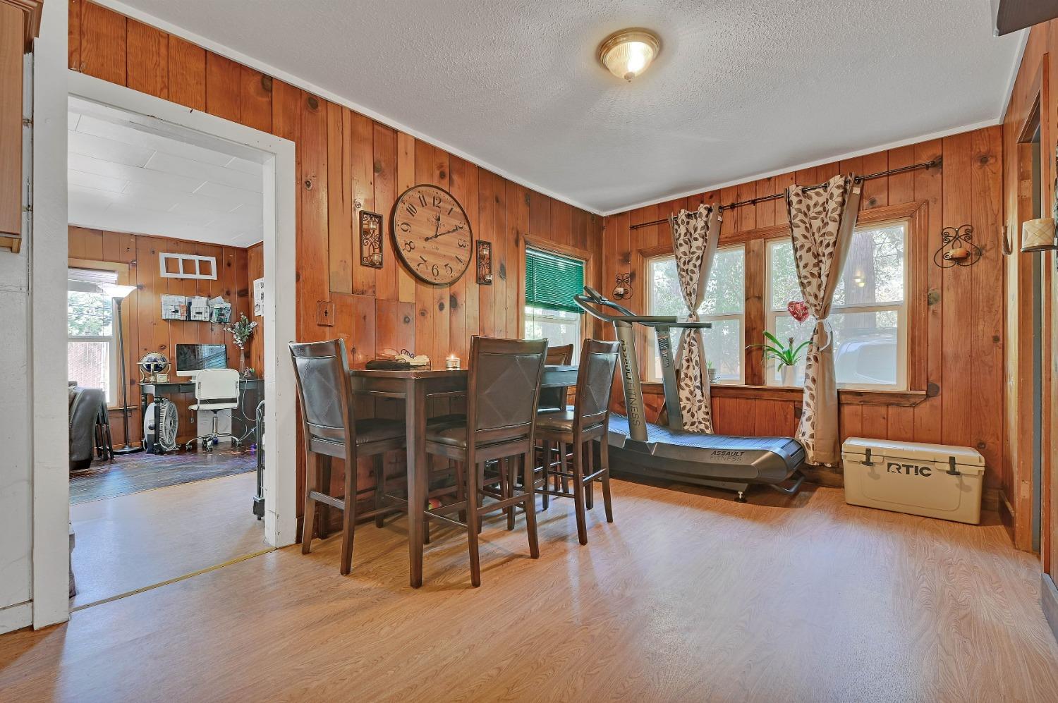 6016 Pony Express Trail Pollock Pines, CA 95726 - Photo 12 of 53 a living room with furniture a rug and a large window