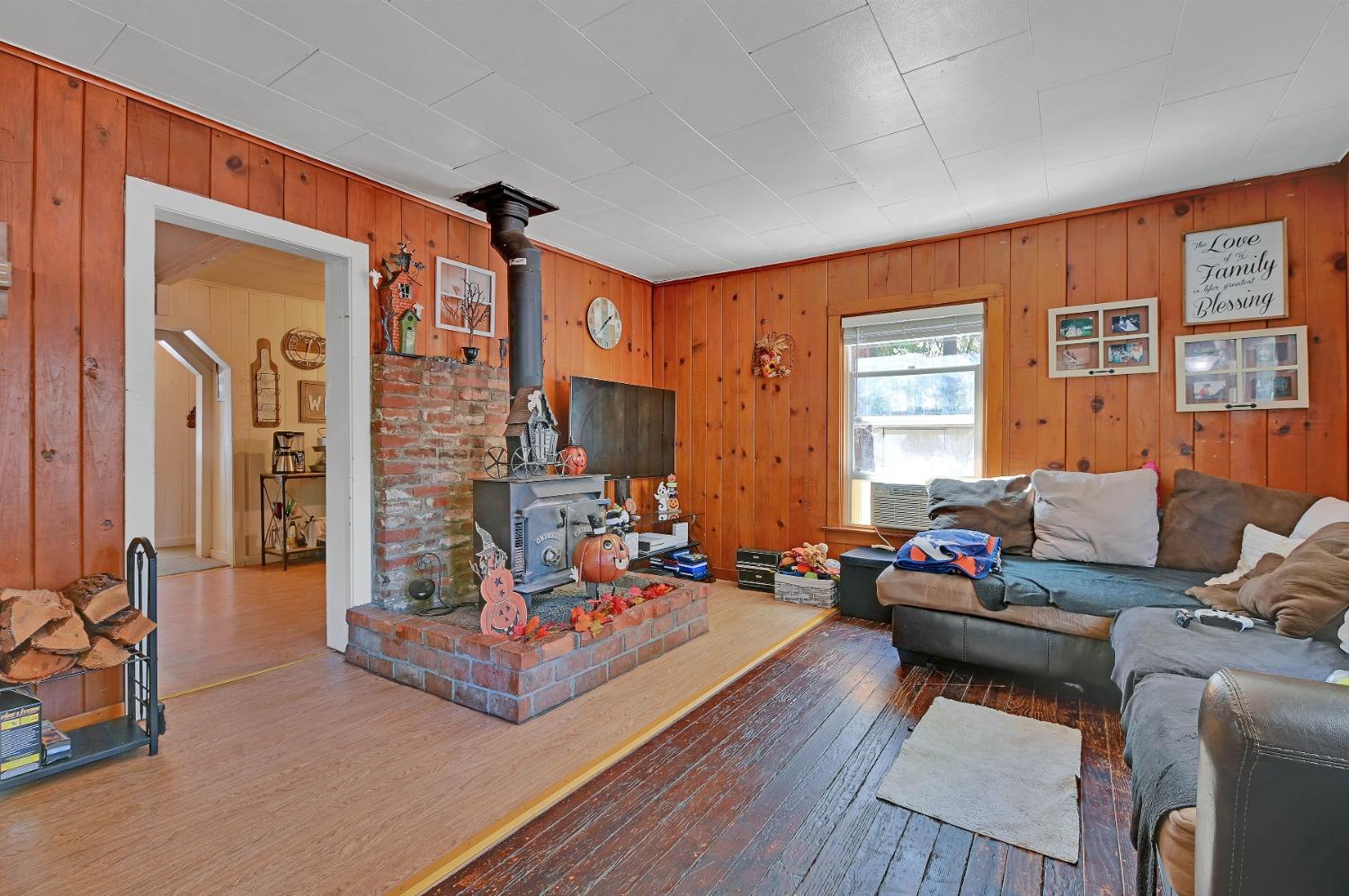 6016 Pony Express Trail Pollock Pines, CA 95726 - Photo 17 of 53 a living room with furniture and a large window