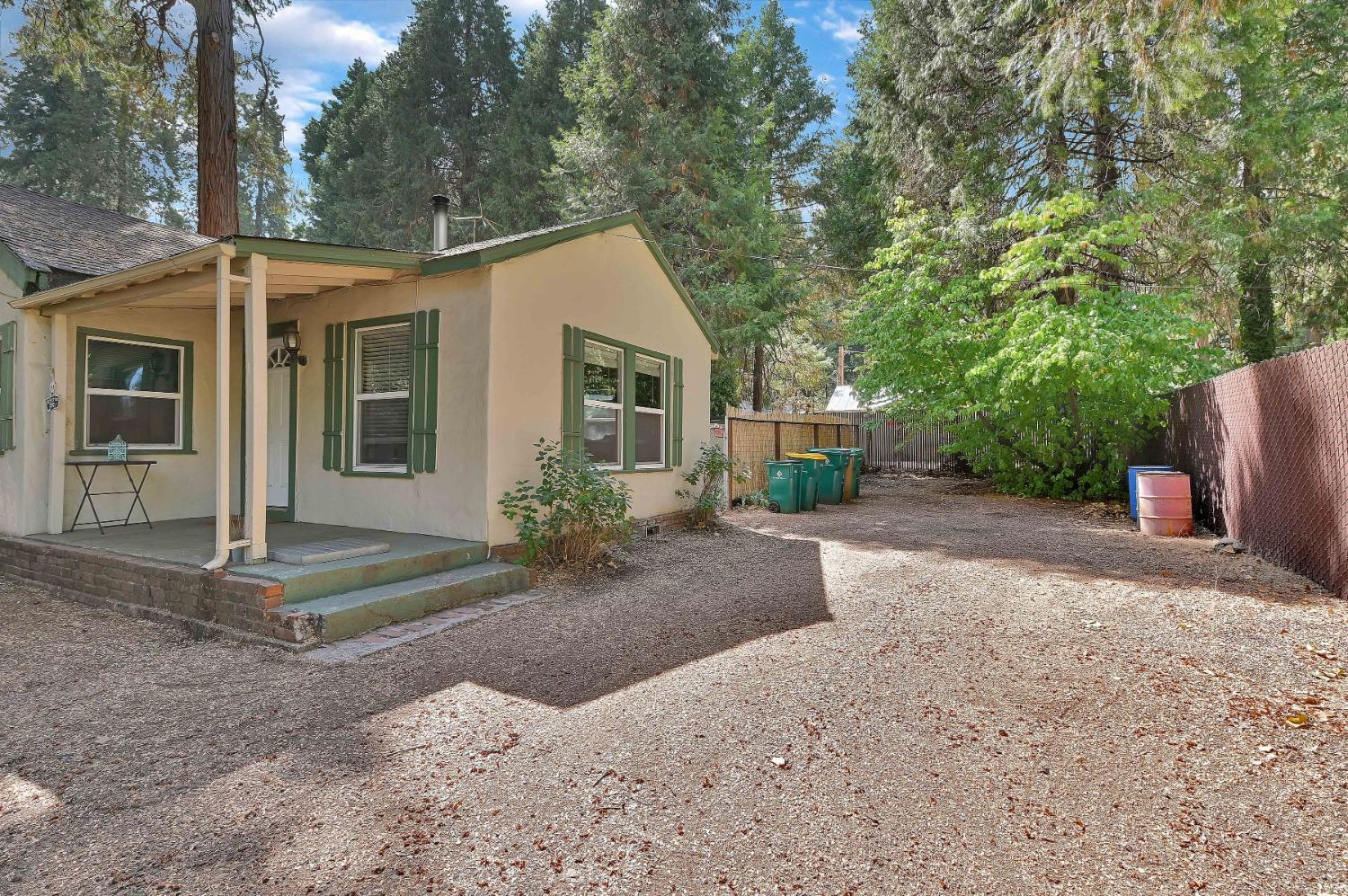 6016 Pony Express Trail Pollock Pines, CA 95726 - Photo 18 of 53 a view of a house with a yard and large tree