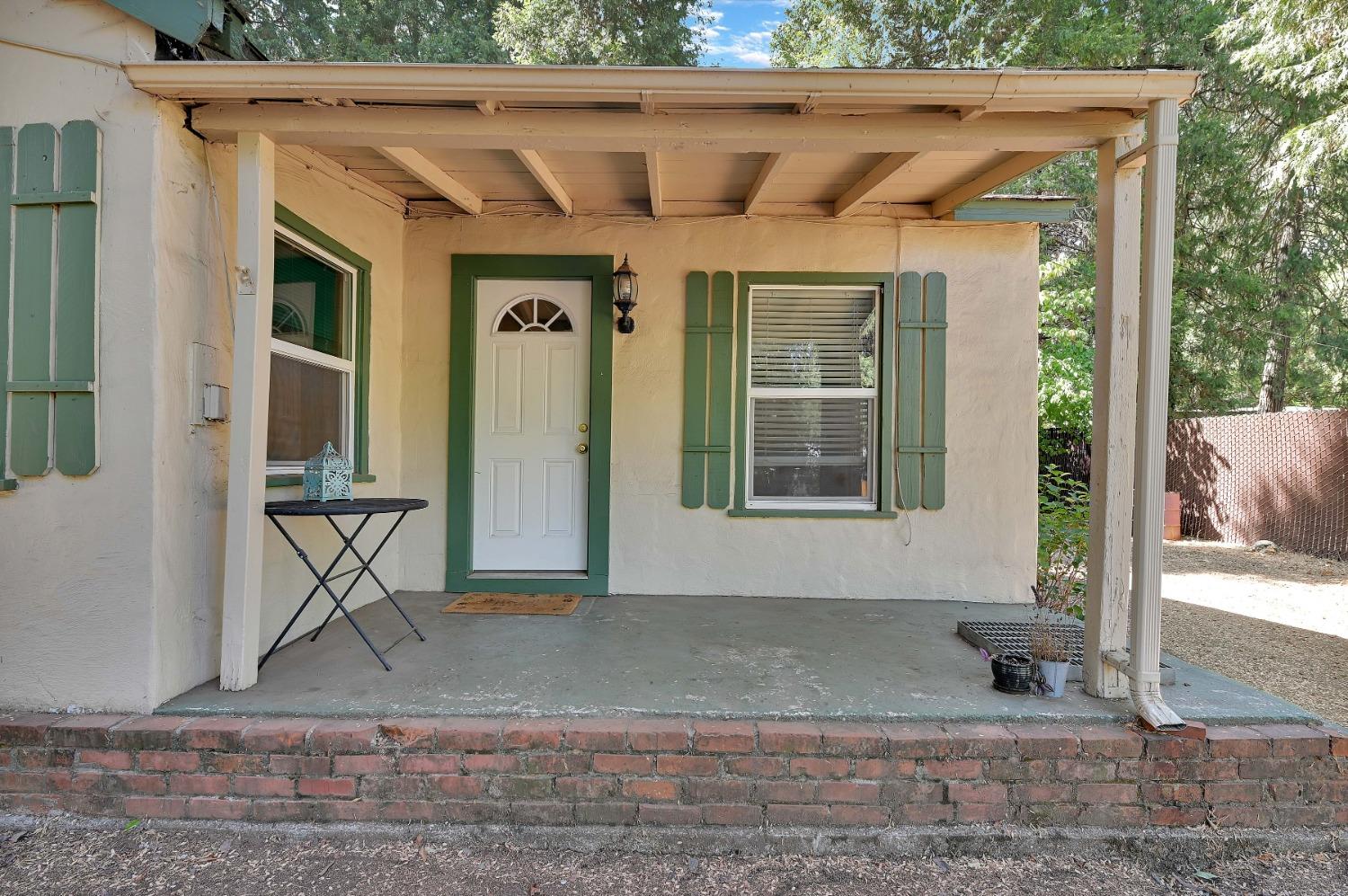 6016 Pony Express Trail Pollock Pines, CA 95726 - Photo 20 of 53 a front view of a house with a yard