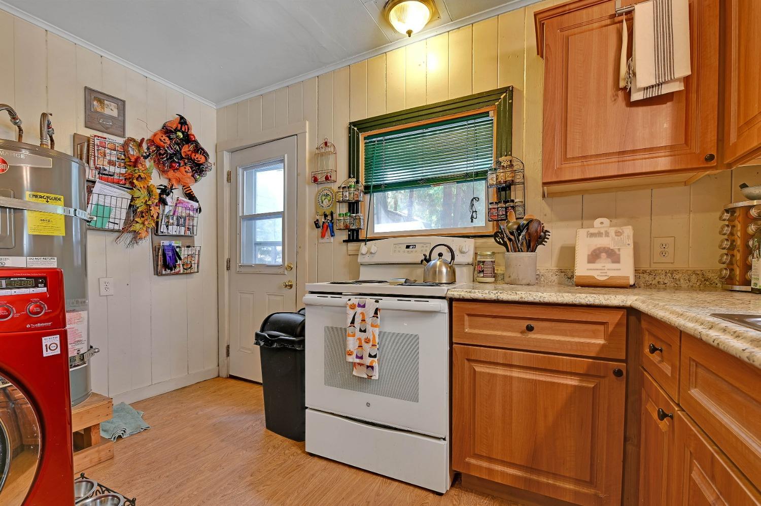 6016 Pony Express Trail Pollock Pines, CA 95726 - Photo 2 of 53 a kitchen with stainless steel appliances granite countertop a stove and a sink