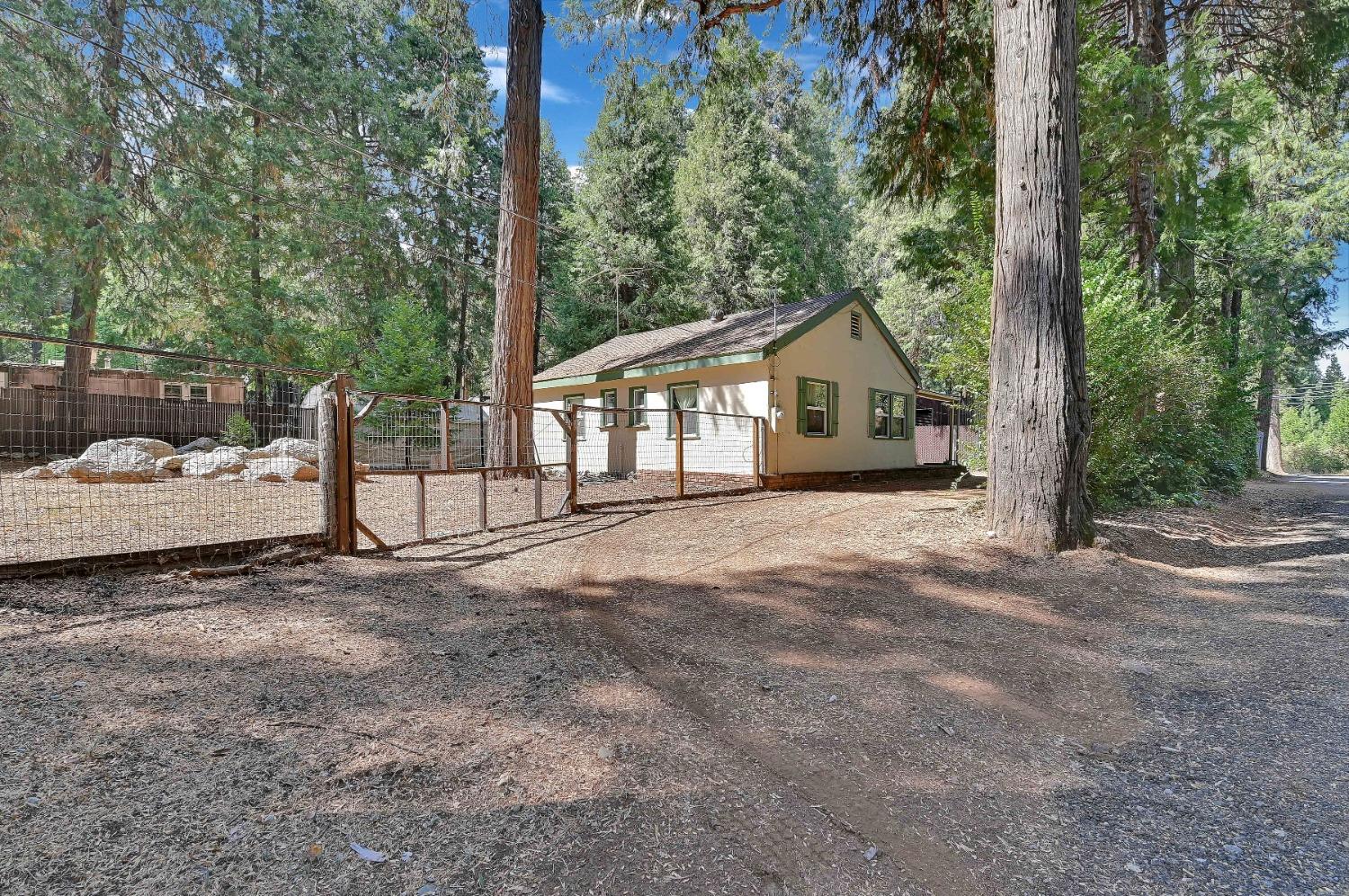 6016 Pony Express Trail Pollock Pines, CA 95726 - Photo 21 of 53 a view of a house with a yard