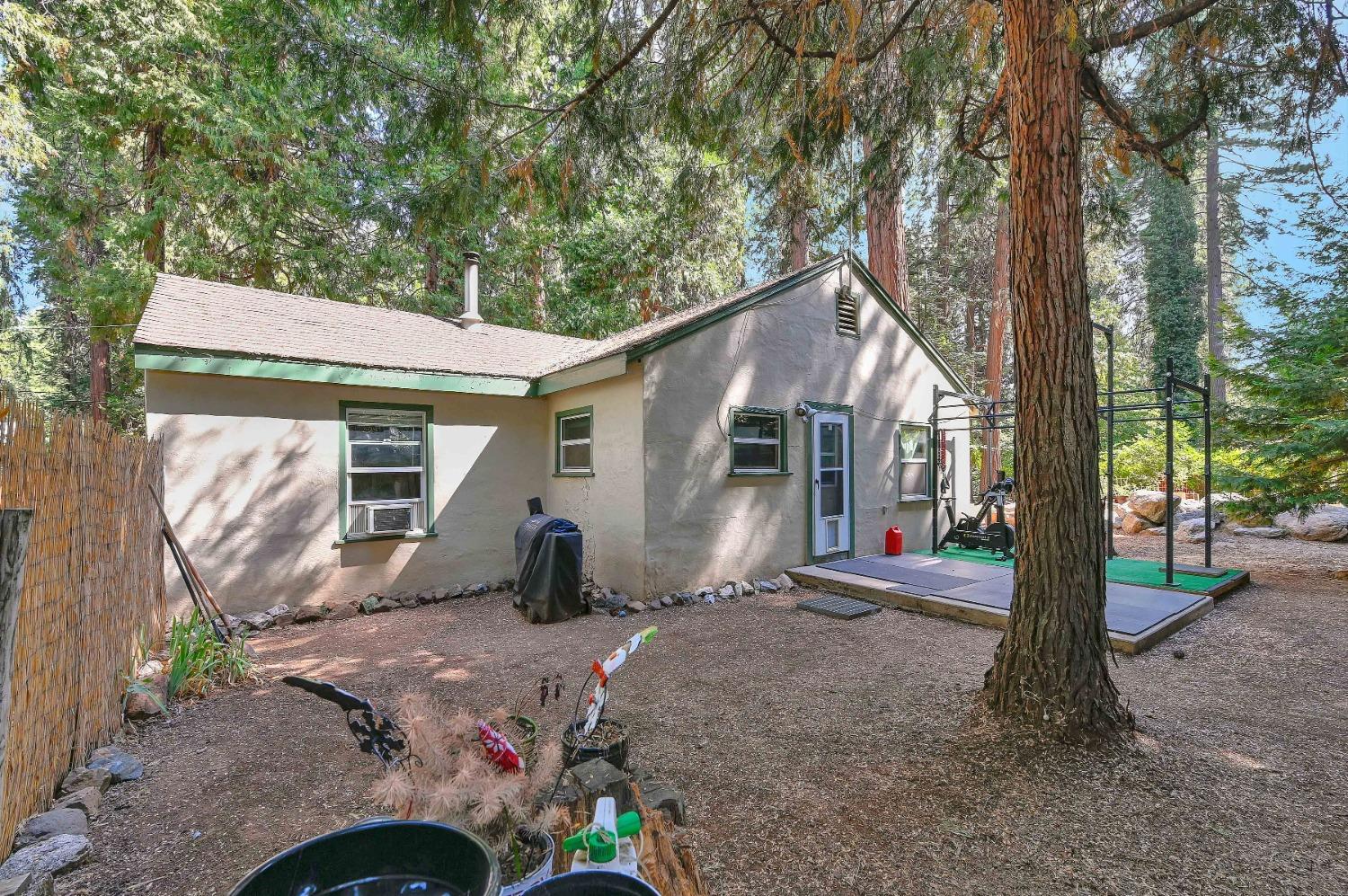 6016 Pony Express Trail Pollock Pines, CA 95726 - Photo 23 of 53 a front view of a house with a yard