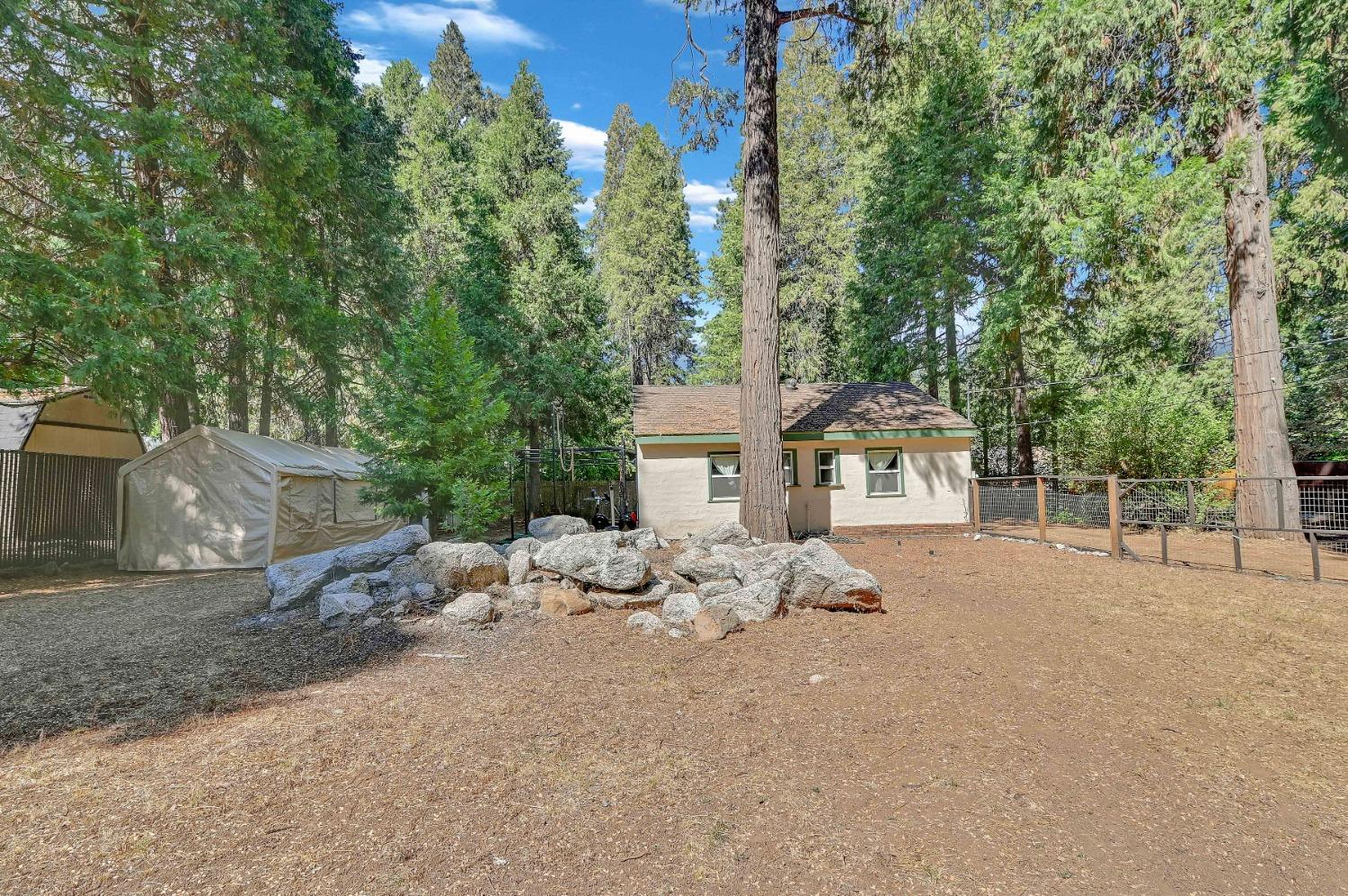 6016 Pony Express Trail Pollock Pines, CA 95726 - Photo 27 of 53 a view of a house with a yard and tree s