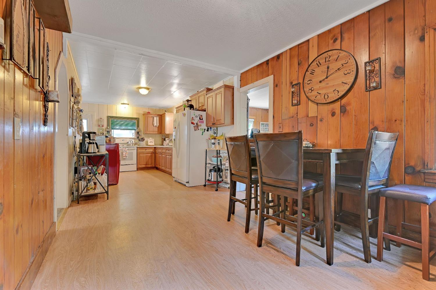 6016 Pony Express Trail Pollock Pines, CA 95726 - Photo 3 of 53 a view of a kitchen with furniture and a refrigerator